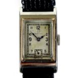 An Art Deco Omega stainless steel cased lady's tank wristwatch, with square silvered dial, black