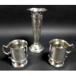 A group of three silver items, comprising a trumpet shaped vase with wave rim and spiral fluted