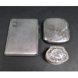 Two silver cigarette cases, one Edward VII, the body engraved with scrolling foliage, central