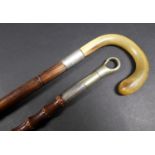 A vintage early to mid 20th century silver collared walking cane, with horn handle, rubbed