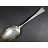A George III silver old English pattern table spoon, with indistinct monogram to its finial,