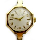 A Garrard 9ct gold lady's wristwatch, circa 1969, with octagonal case, circular silvered dial with