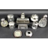 A group of Victorian and later silver topped dressing table jars, various designs and makers, one