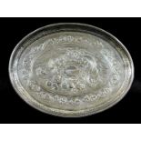 A George III Irish silver waiter tray, of oval form with engraved decoration of flowers surrounded