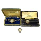 A group of three Edwardian lady's wristwatches, comprising a J. W. Benson 9ct gold cased wristwatch,