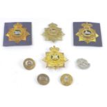 Four British Army Helmet plates and four helmet centres, comprising Hampshire, Devonshire and