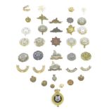A collection of thirty-five Lincolnshire and Northampton regimental badges, including a Grantham