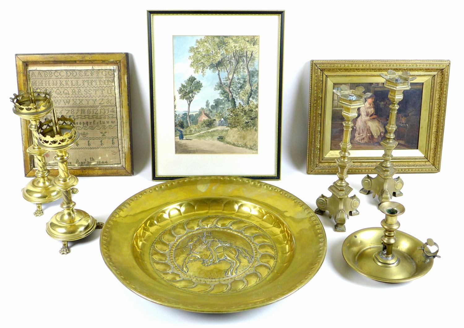 A collection of brass items, including an early 19th century brass chamber stick with candle