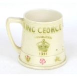 A Moorcroft commemorative King George V and Queen Mary Coronation mug, with impressed mark and 'From