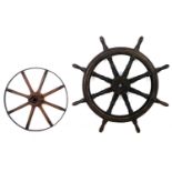 A 19th century ship's wheel, with eight turned spokes and handles, brass inlaid, 106 by 106 by 8cm