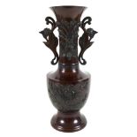 A modern Chinese bronzed vase, of baluster form with long flared neck having pierced and scrolled