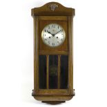 An Art Deco mahogany veneered wall clock, silvered dial signed 'Haller A.G', black Arabic