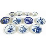 A collection of 18th century and later blue and white tea bowls and saucers, including a Worcester