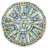An Italian maiolica charger, early 20th century, decorated with twelve panels around a central