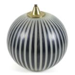 A mid 20th century spherical glass light shade, decorated with alternating bands of black and