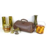 A group of collectables, including a pair of shell case vases, a vintage Gladstone bag, and two