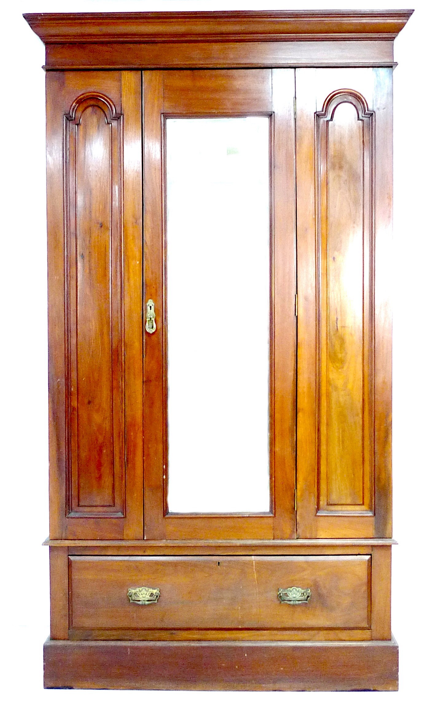 A Victorian mahogany wardrobe, with single bevelled mirror door enclosing a hanging space, and