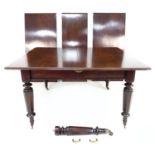 A Victorian mahogany dining table, with turned legs on castors, and pull-out action three additional