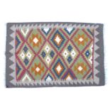 A olive green ground Maimana kelim rug, 93 by 60cm.