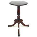 A mahogany wine table, the circular surface with moulded edge, raised on a turned column and three