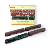 A Hornby OO gauge Tornado Express model train set, with locomotive, tender, three carriages