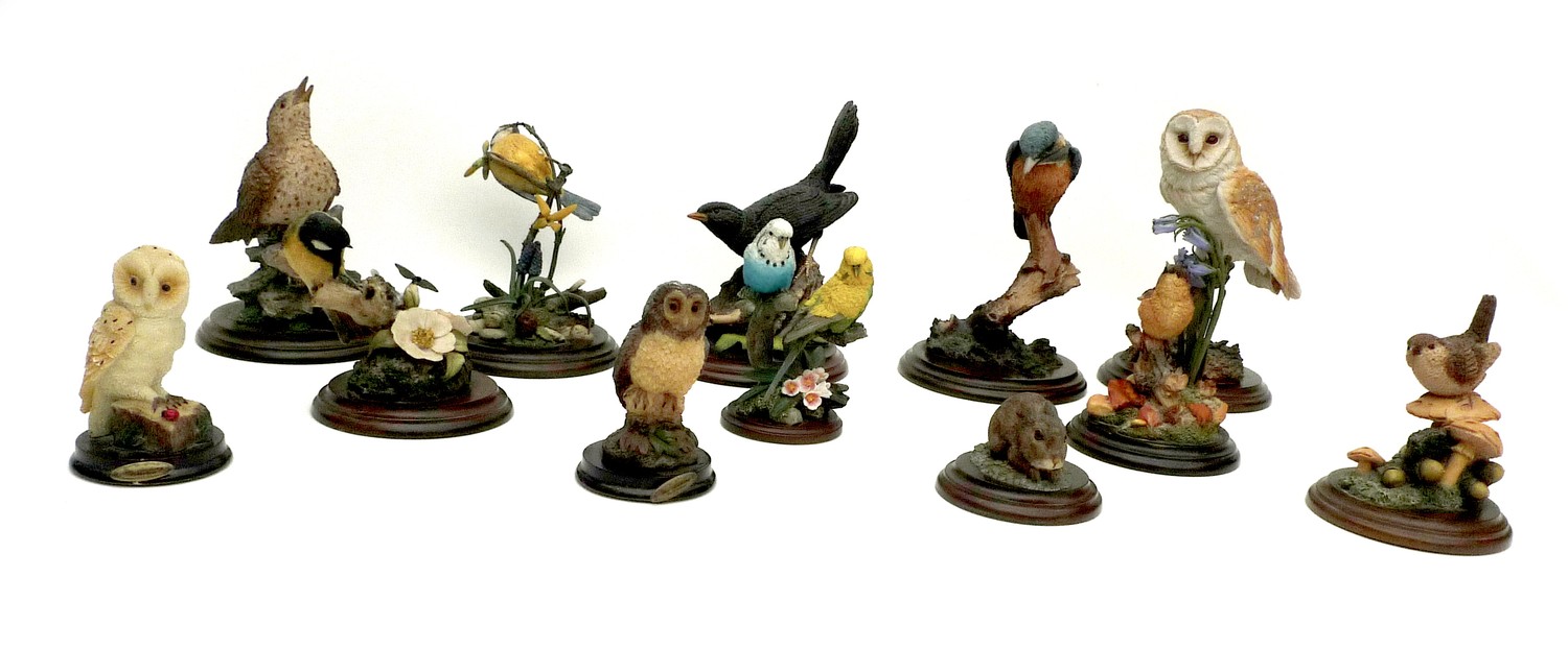 A group of eight Country Artists bird figurines, comprising Barn Owl, 22cm high, Kingfisher, 21cm