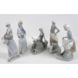 A group of five Lladro figures, comprising Armful of Lilies, number 4972, 24cm high, Peasant Girl