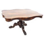 A Victorian rosewood breakfast table, fixed top of serpentine outline, moulded decoration, raised on