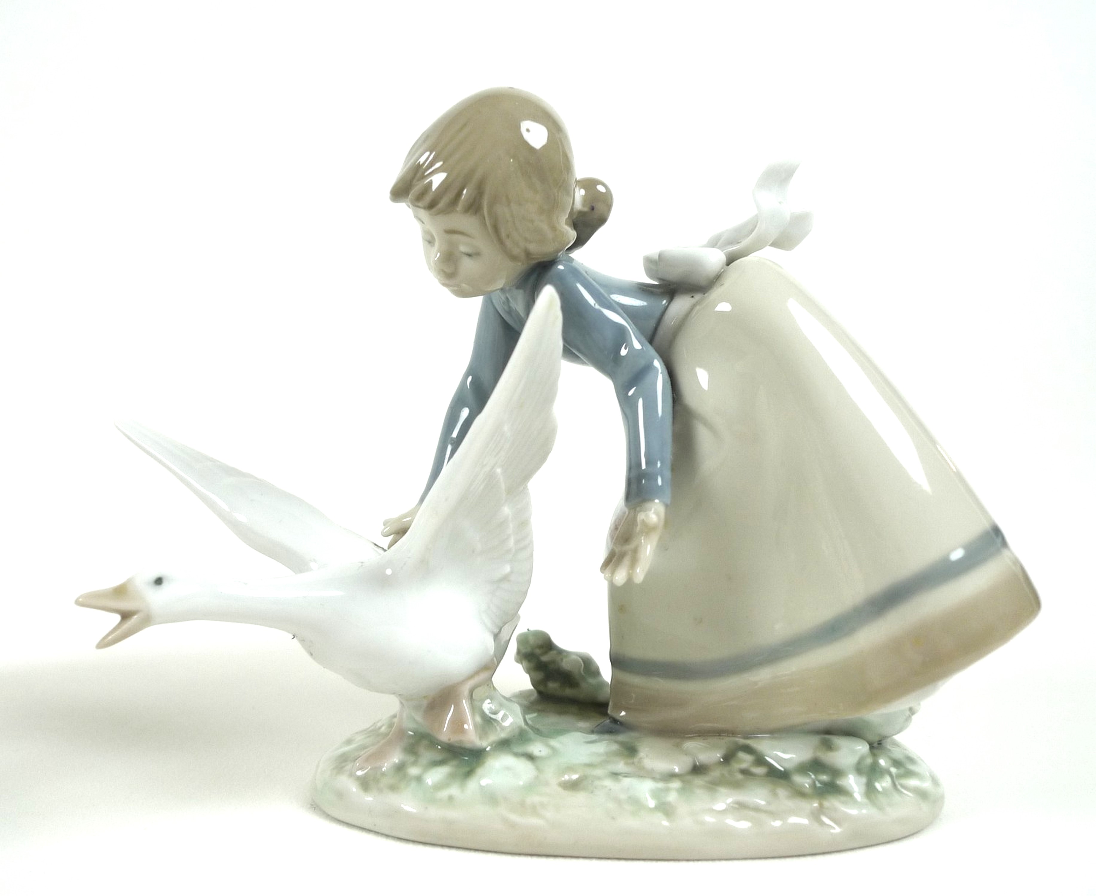 A group of six Lladro figures, comprising Wild Goose Chase, number 5553, 15cm high, Nino con - Image 4 of 10