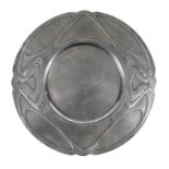 An Art Nouveau pewter plate in the style of Liberty's Tudric, sticker to underside reads 'Hornsby