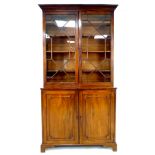 A George IV / William IV mahogany bookcase, by Wilkinson, Ludgate Hill, twin astragal glazed doors