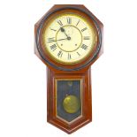 An Ansonia Clock Company drop dial wall clock, wtih Roman numeral dial, 29cm diameter, pendulum