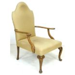 An Edwardian mahogany open armchair, in Queen Anne style, upholstered in cream foliate fabric, 72 by