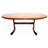 A G-Plan teak oval dining table, circa 1970, extending with integral central leaf, 46cm wide, with