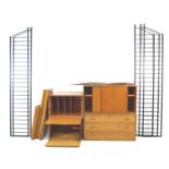 A set of Ladderax, Staples, adjustable shelving units, with four storage, desk and drawer units,