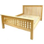 A modern oak veneered double bed frame, with slatted ends, comprising headboard, footboard, two side