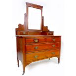 An Edwardian mahogany dressing chest, with mirror top and two over two drawers, 107 by 52 by 156cm