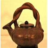 Clay pumpkin shaped sake pot. Twisted clay handle and animal as a spout. From Lombok. 25 x 21cm. New