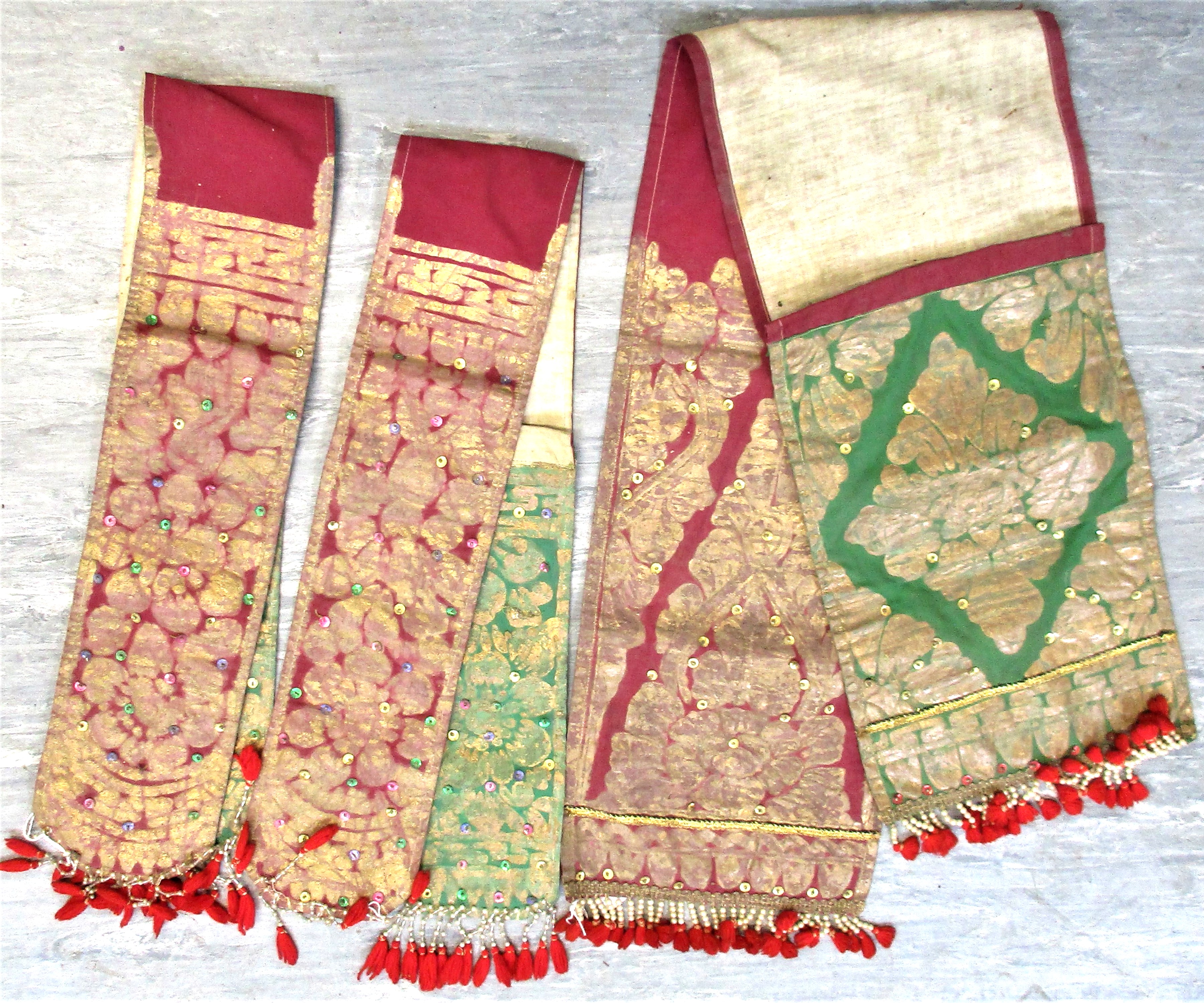 3 very old dress ornaments from Bali. Each 90 x 20cm. Early 20th c. Notes: These would be worn