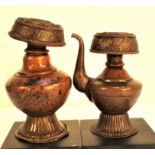 Brass water jug and pot from Nepal. These would have belonged to a Buddhist family home, note the