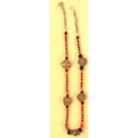 Necklace of antique white metal beads and coral stones. 26cm.