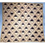 Cut-pile raffia from Kuba, Zaire. An intricate geometric design also found in their wood carvings
