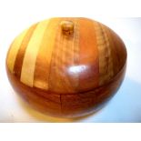 Round wood box with lid. Hand carved in Cuba from a mosaic of different woods. 15 x 15 x8cm. New