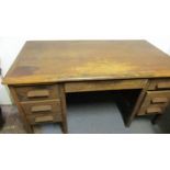 Knee hole desk. One side has 3x drawers, other side 1x drawer and deep file drawer. There is a