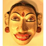 Balinese hand painted wooden Topeng mask of a courtier with shell teeth. 16 x 15cm. Mid 20th c.