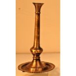 Brass candle stick from Nepal. 20 x 11cm. Early 21st c.