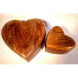 Two heart shaped boxes with lids. Carved in Mango wood from India. Mango wood is a prolific and