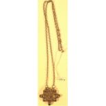A pendant of an antique white metal amulet from Afghanistan on a chain. 32cm.
