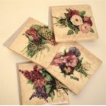 Set of 4 ceramic coasters with flower designs. 4 rubber cushion pads on bottom. Stored in display