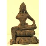 Bronze staue of Buddha sitting in the teaching position on a lotus flower. Fine features on the face